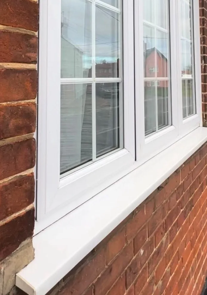 After: the same Earsham window with the sill, frames and glass cleaned bright white